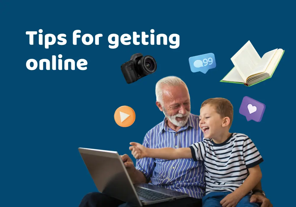 Grandfather and grandson looking at laptop together 