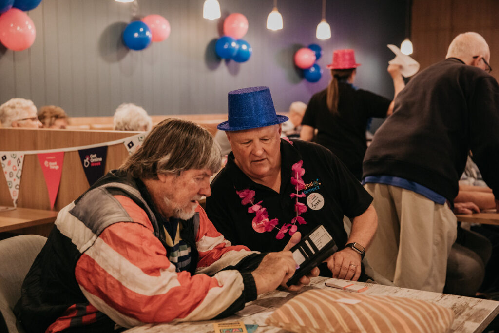 Two older men at a Get Online Week event