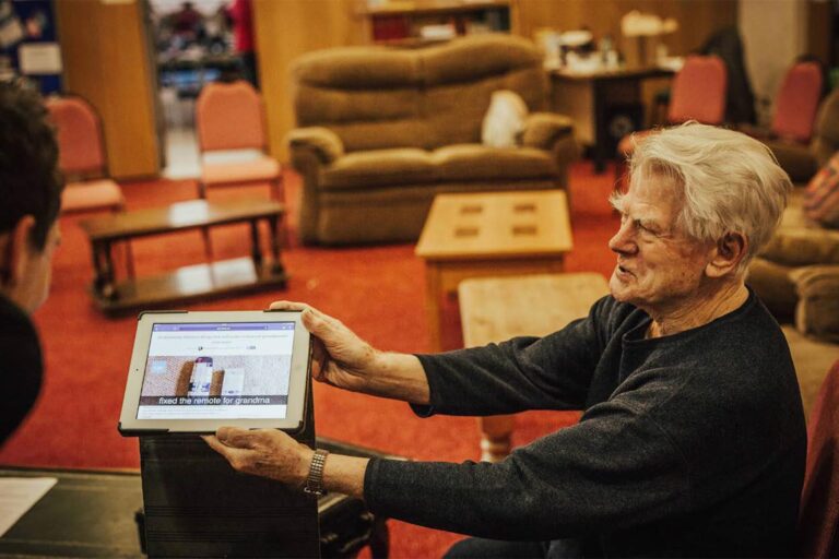 An older man shares a photo that shows how he fixed the remote control for grandma