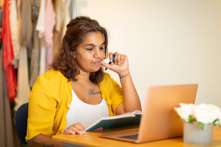 Woman looking at laptop