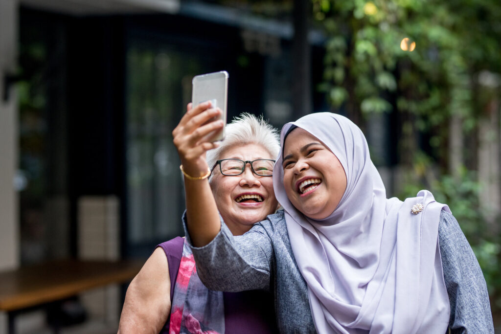 Two Happy Women Taking Selfie With Mobile phone